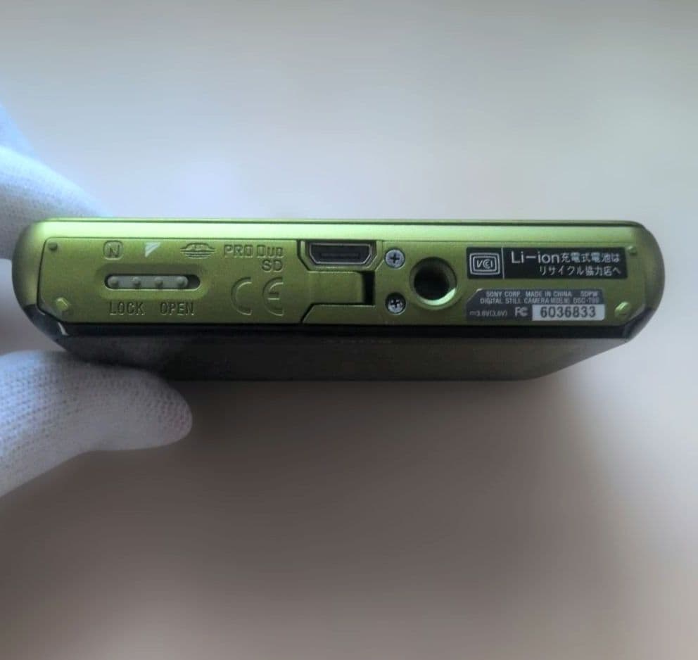 SONY Cyber-shot DSC-T99 (Green) with Mickey Mouse case