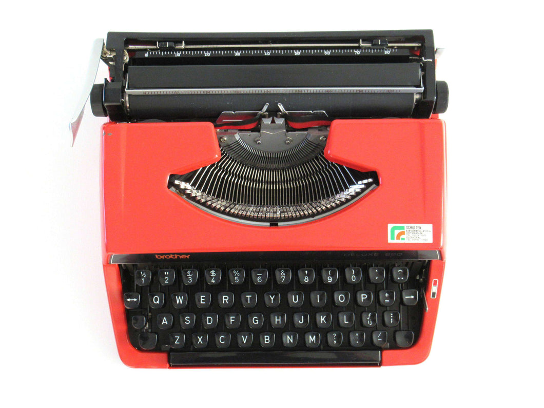 Brother Deluxe 220 working typewriter. Red metal body, two tone