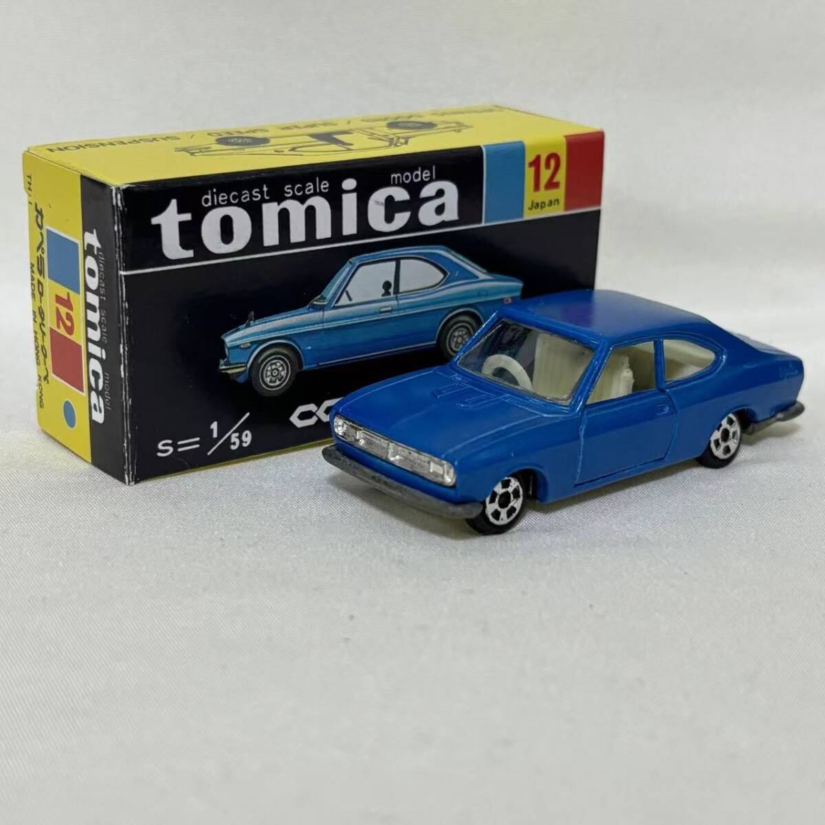 香港トミカ】マツダ カペラ2ドアクーペ／青／グリル造型あり 香港
