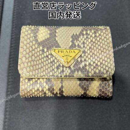 イエロー（黄色）系 PRADA(プラダ) 折りたたみ財布(レディース