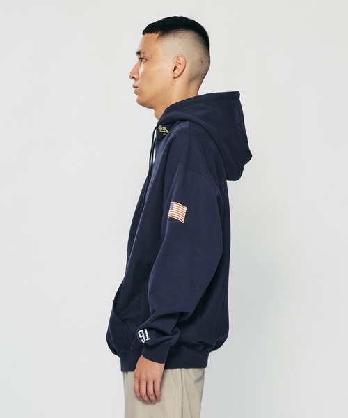 XLARGE（エクストララージ）の「XL LABEL SOUVENIR HOODED SWEAT