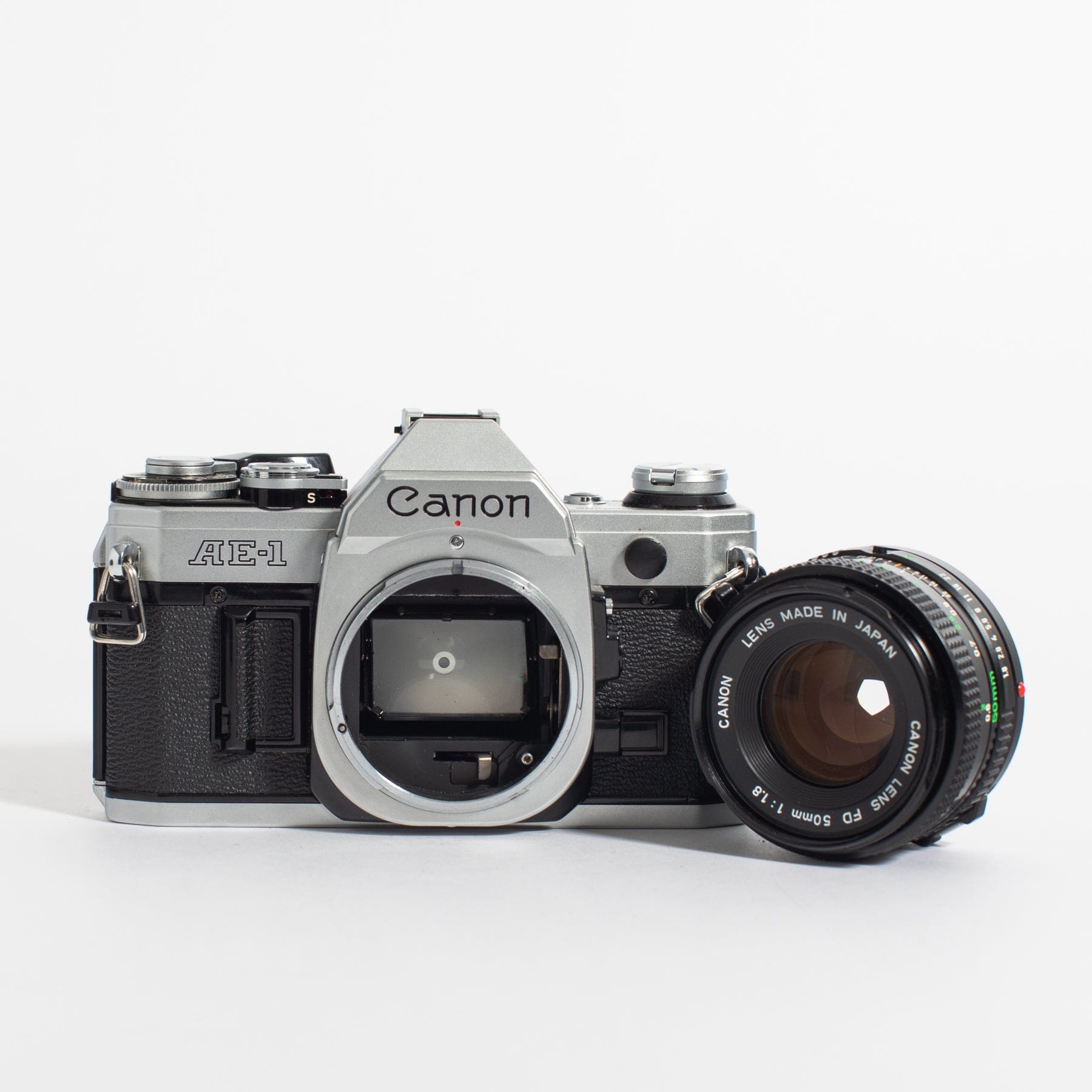 Canon AE-1 w/ 50mm FD f/1.8 and bonus telephoto zoom lens, body no