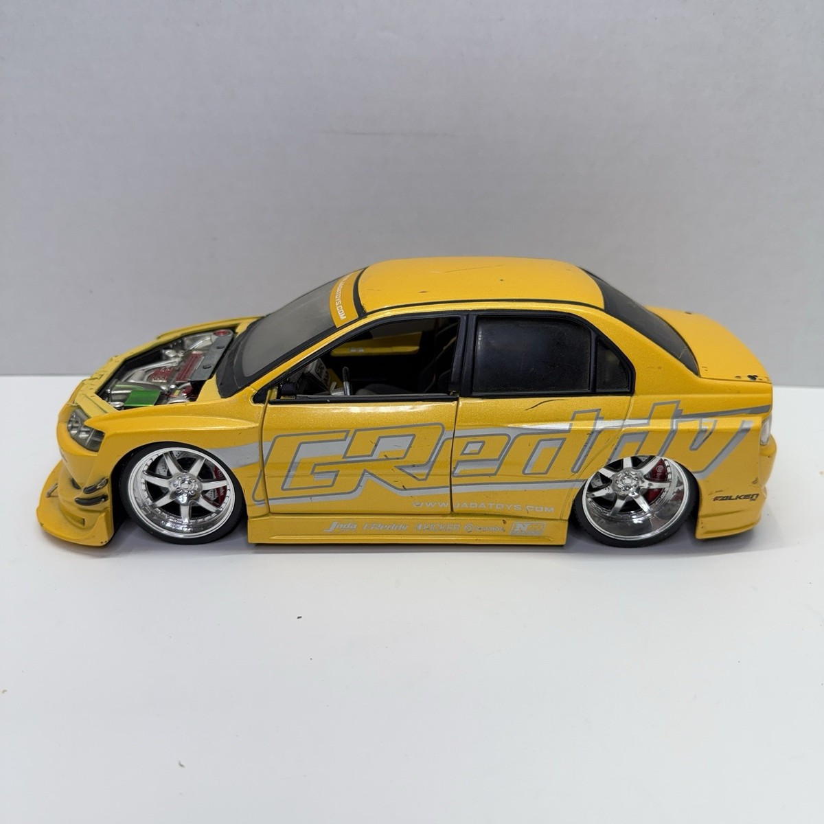 1:18 JADA Mitsubishi Lancer Evolution VIII GReddy Yellow IMPORT