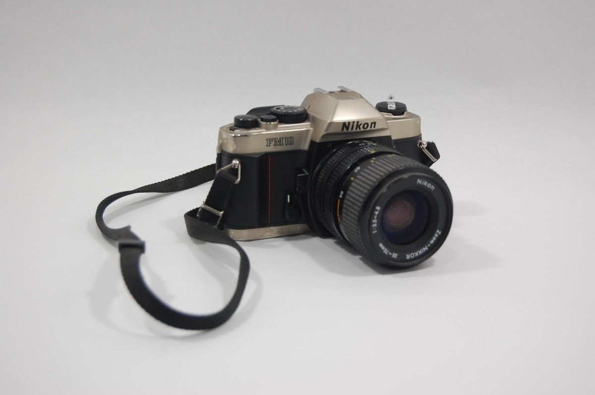 Read Nikon FM-10 SLR Camera with 35-70mm 1:5-4.8 Zoom Lens