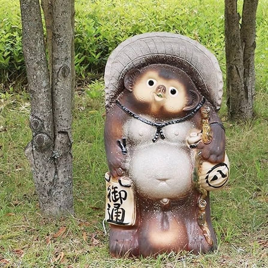 ウッシッシとほくそ笑む図太いタヌキ 骨董 古美術 狸人形 置物 縁起物