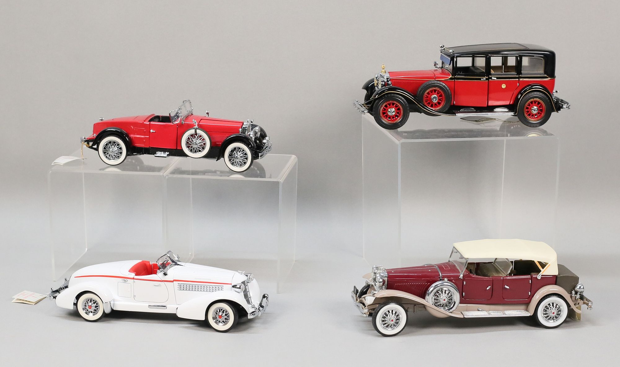 Lot of 4 Franklin Mint Model Cars 1/24 Scale sold at auction on