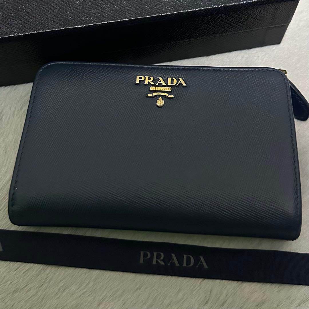 PRADA プラダ 折り財布 ラウンドファスナー ブルー ゴールドロゴ シボ