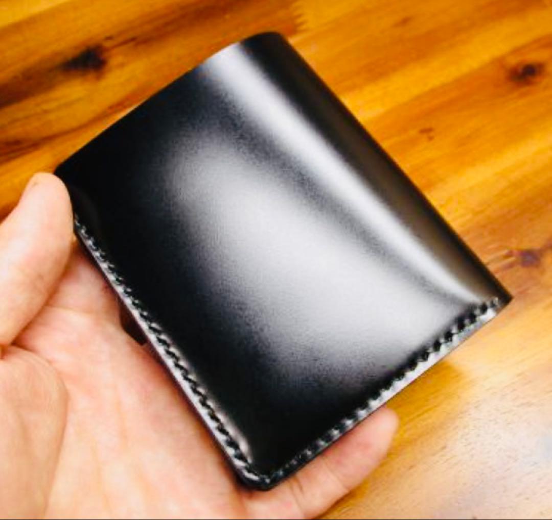 か*ん様 世界に１つ❗️新喜皮革 コードバン ブラック 黒 手縫い 二つ折り 栃