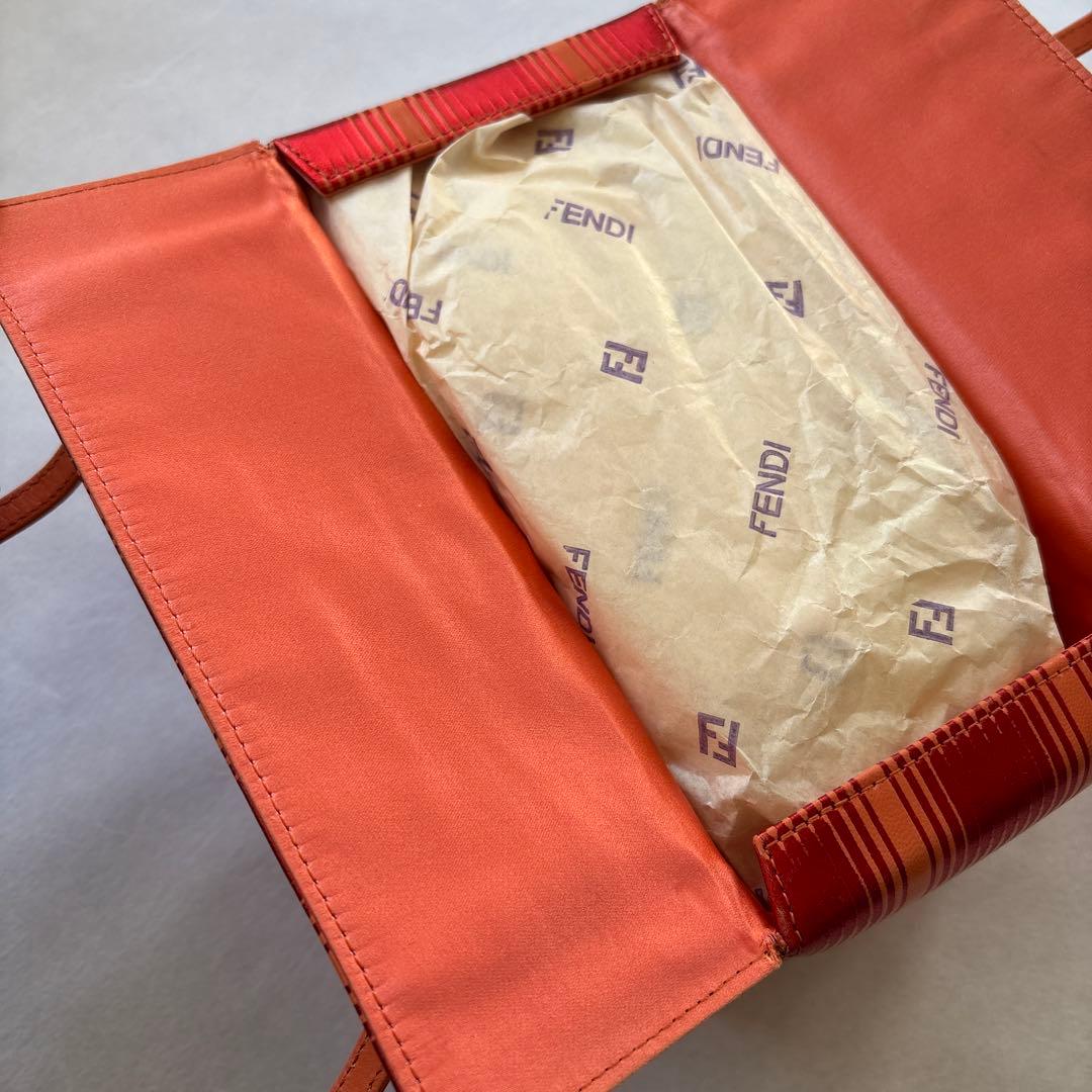 たく FENDIオレンジ ストライプ パーティーバッグ