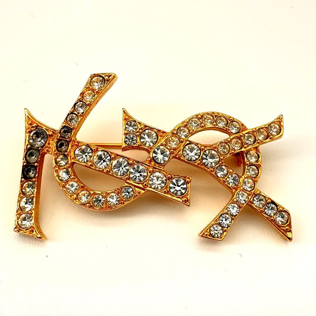イヴサンローラン ブローチ カサンドラ YSL ロゴ ラインストーン