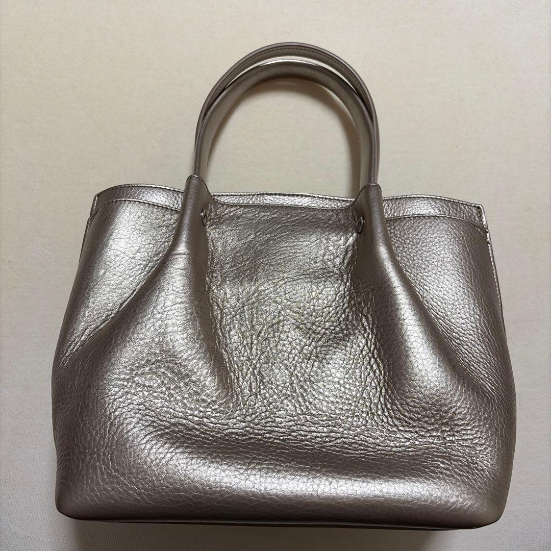 ヒロフ　メタリックゴールド レザー ハンドバッグ