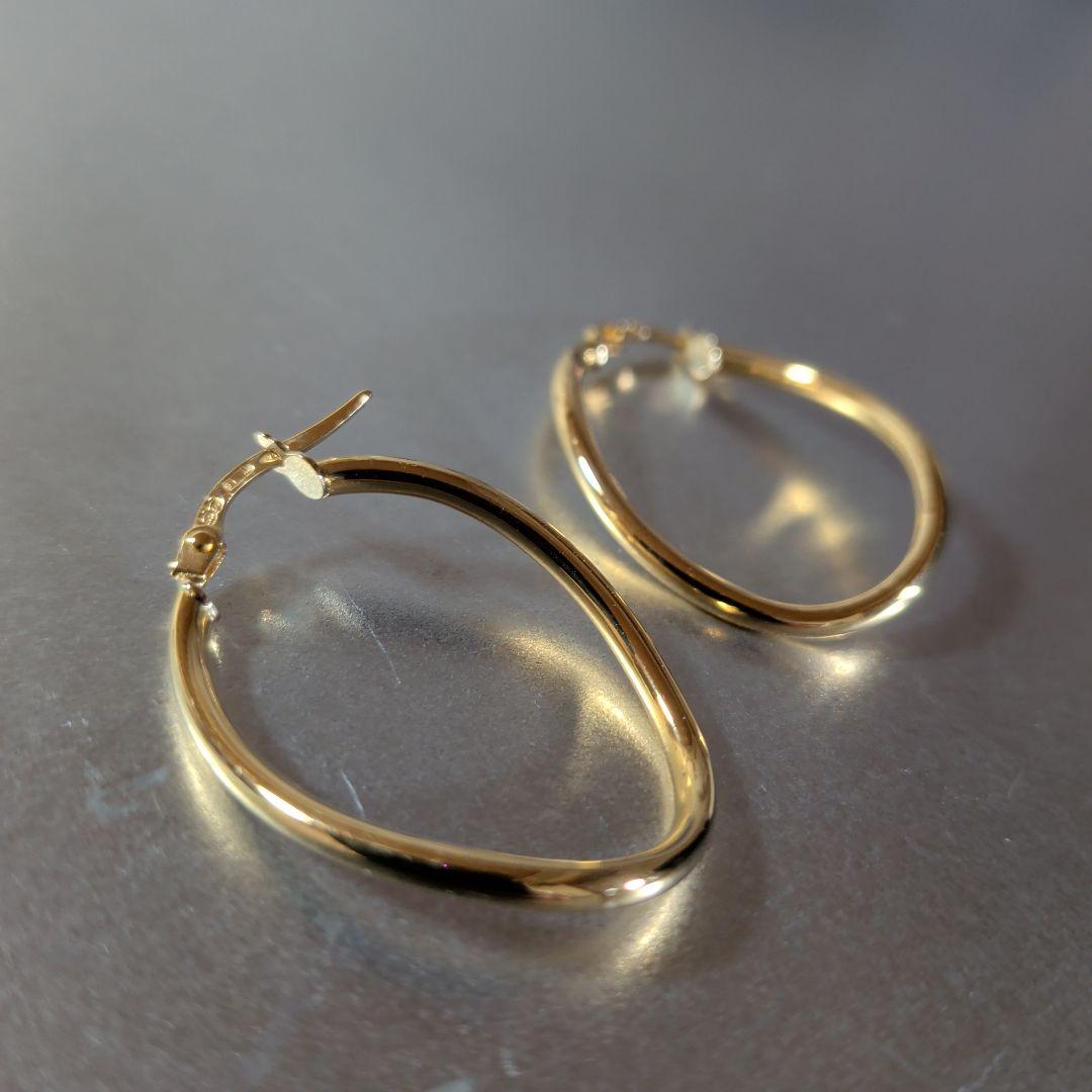 ピアス　UNOAERRE　750　YG　スナップ　ウェーブ　2.59g