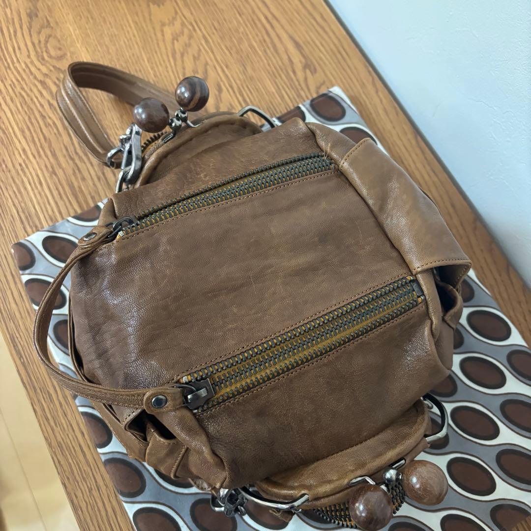 ジャマンピュエッシュ　レザー　ハンドバッグ　木製パーツ　がま口　総柄