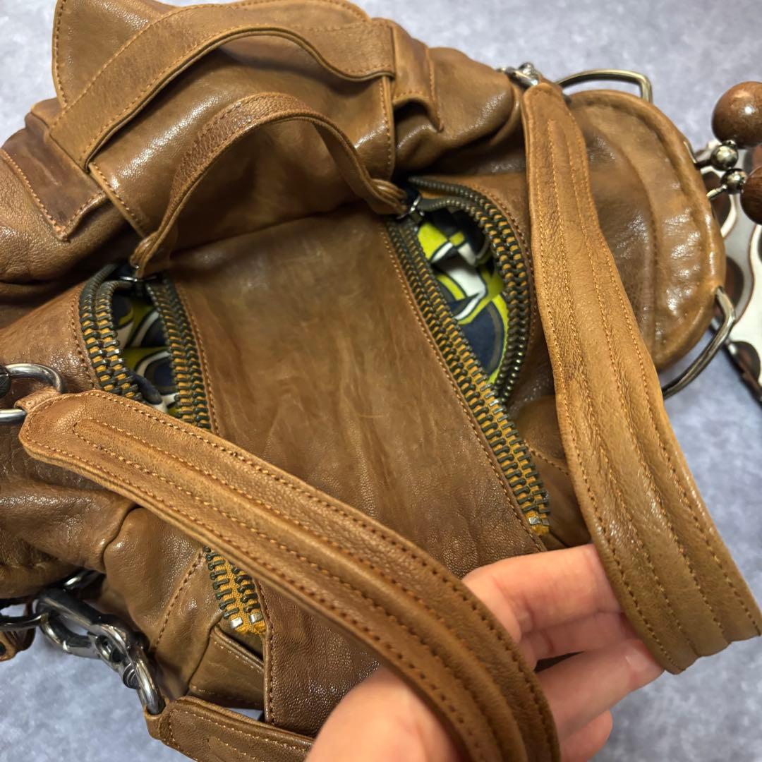 ジャマンピュエッシュ　レザー　ハンドバッグ　木製パーツ　がま口　総柄