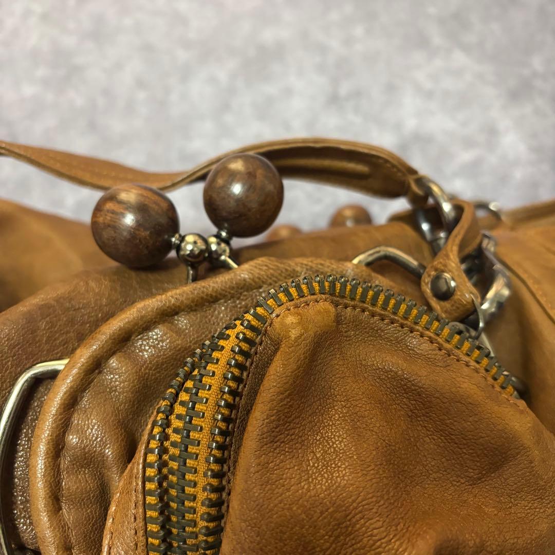 ジャマンピュエッシュ　レザー　ハンドバッグ　木製パーツ　がま口　総柄