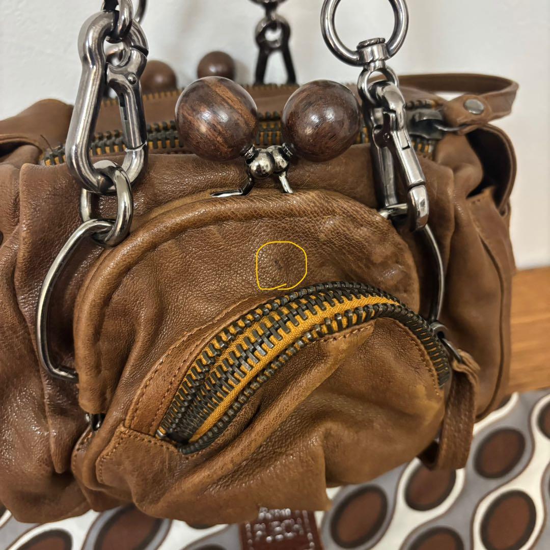 ジャマンピュエッシュ　レザー　ハンドバッグ　木製パーツ　がま口　総柄