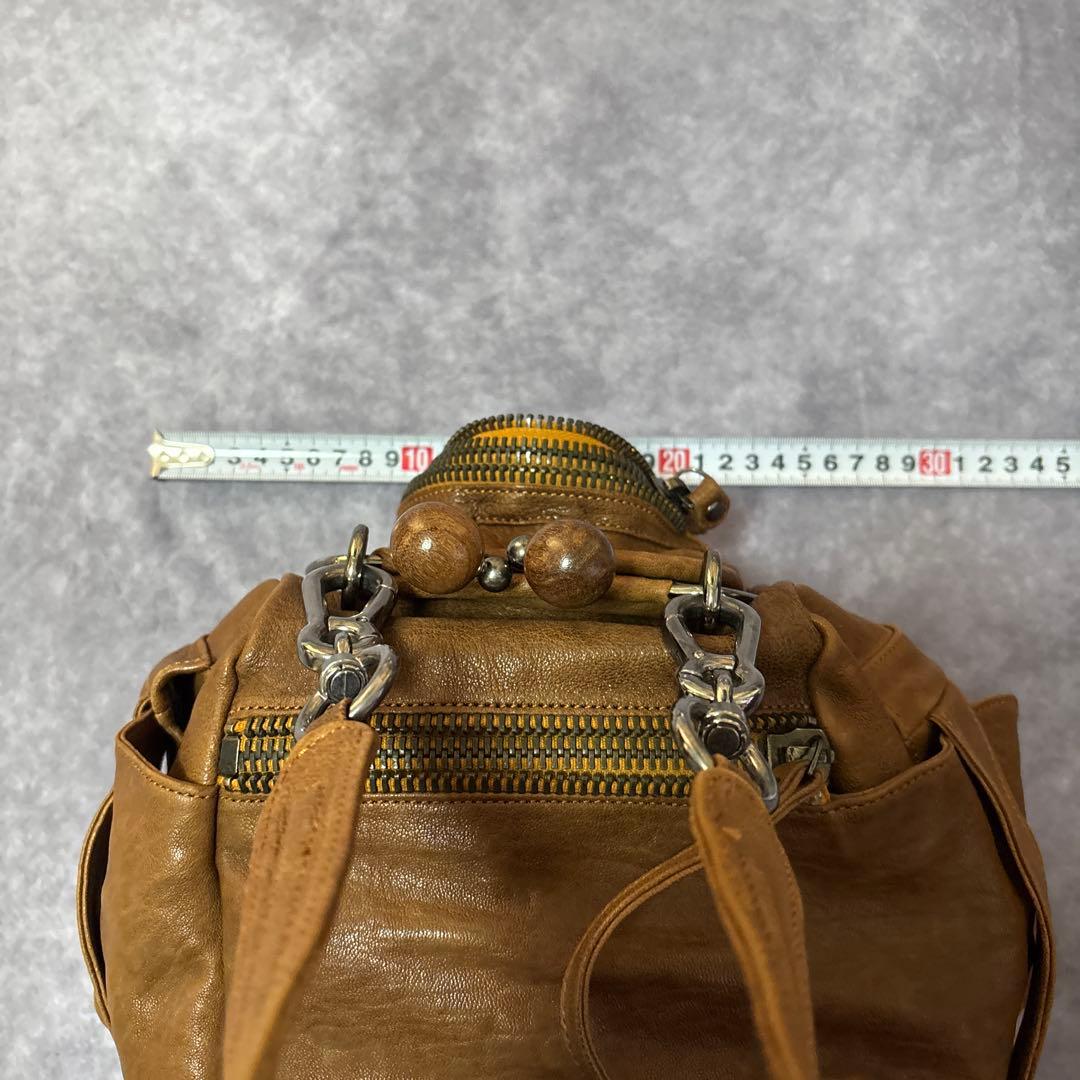 ジャマンピュエッシュ　レザー　ハンドバッグ　木製パーツ　がま口　総柄