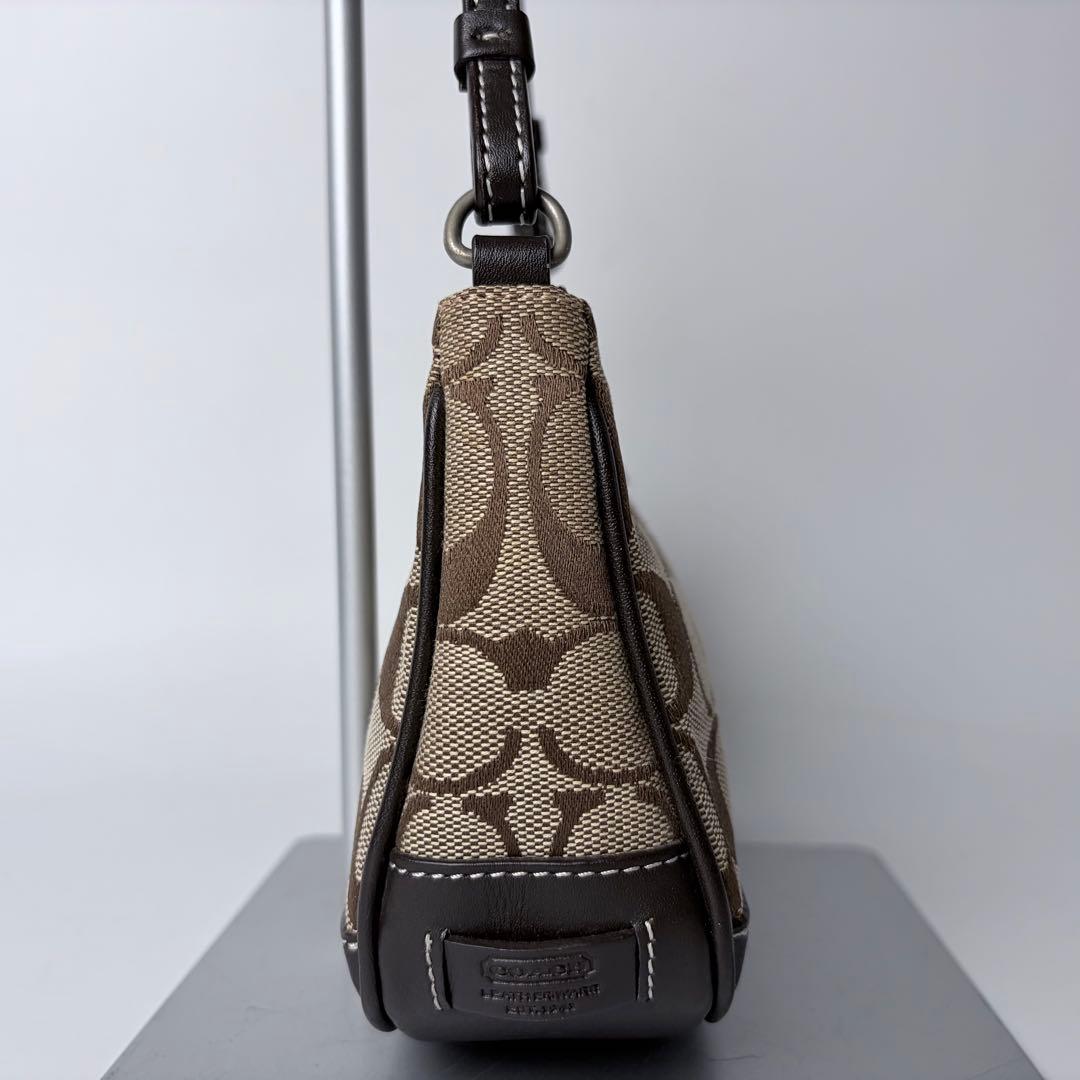 コーチ アクセサリーポーチaccessory pouch6094チャームブラウン