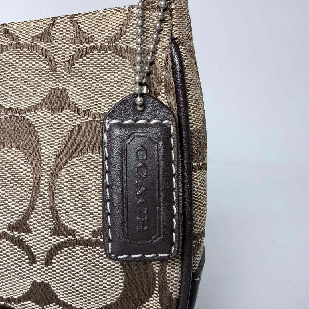 コーチ アクセサリーポーチaccessory pouch6094チャームブラウン