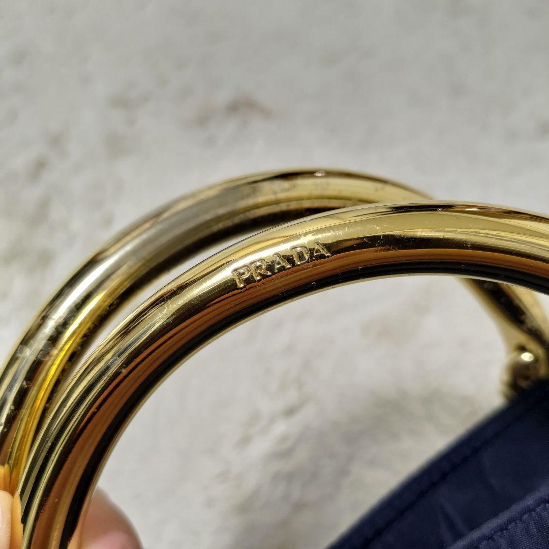 PRADA トライアングルロゴ ミニハンドバッグ ブラック ゴールド