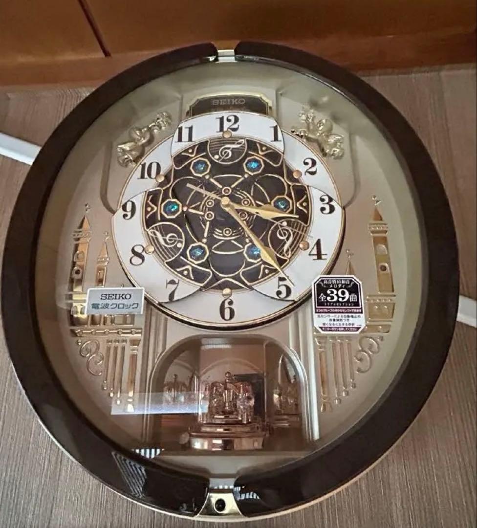 RE579B 電波時計 セイコー 掛時計 壁掛け時計　メロディ機能付き回転飾り