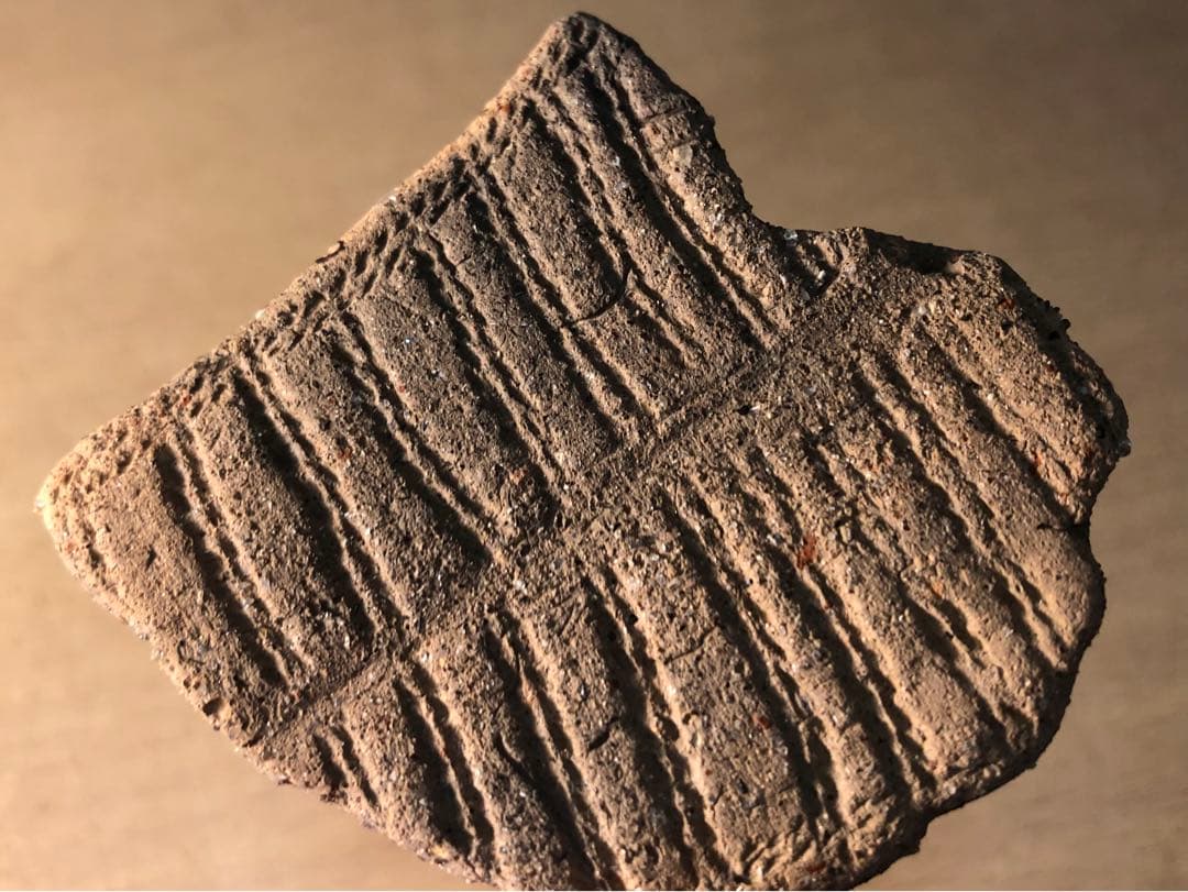 板状土偶の破片」です。