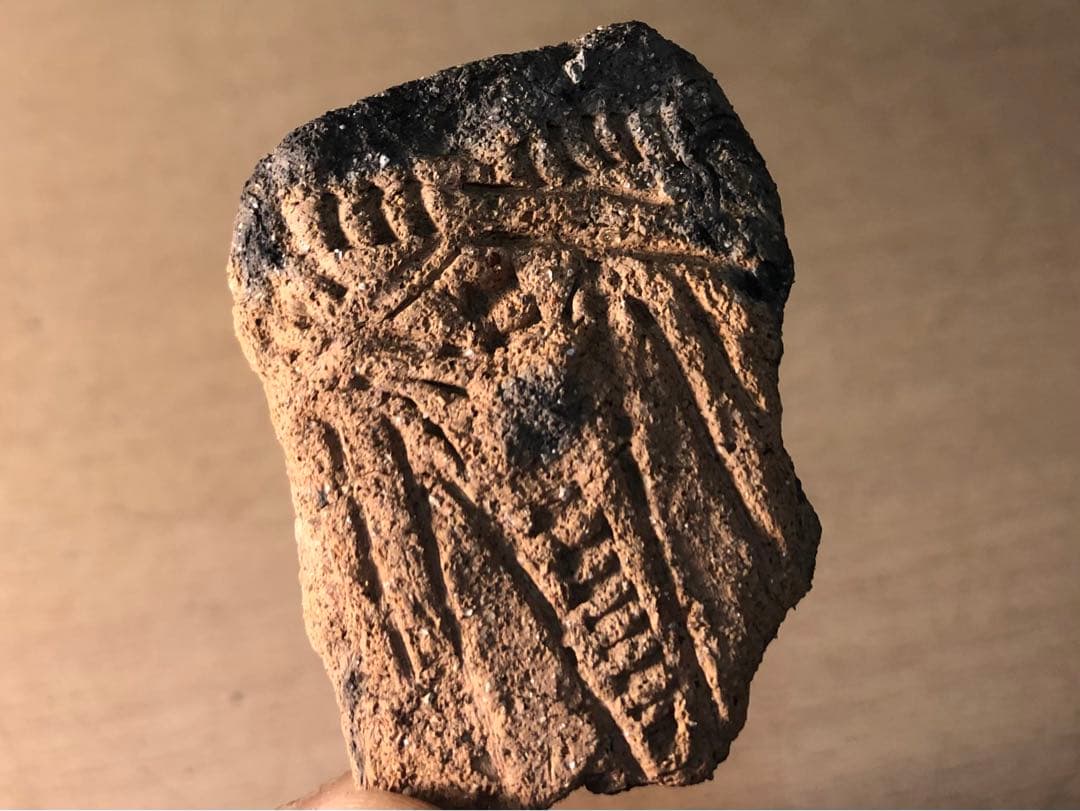 板状土偶の破片」です。