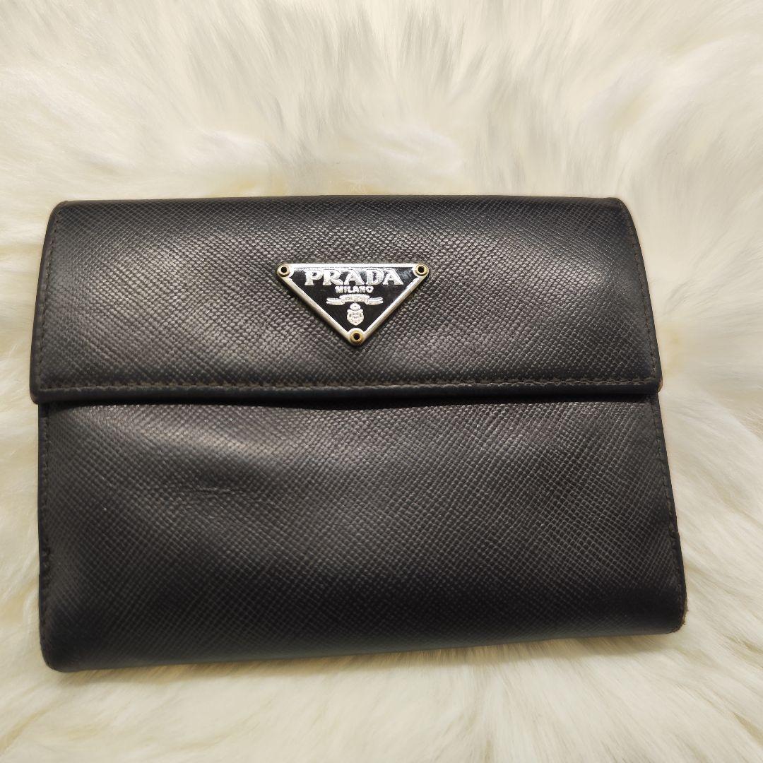 プラダ折り財布サフィアーノレザーブラック三角プレートWホックカード付