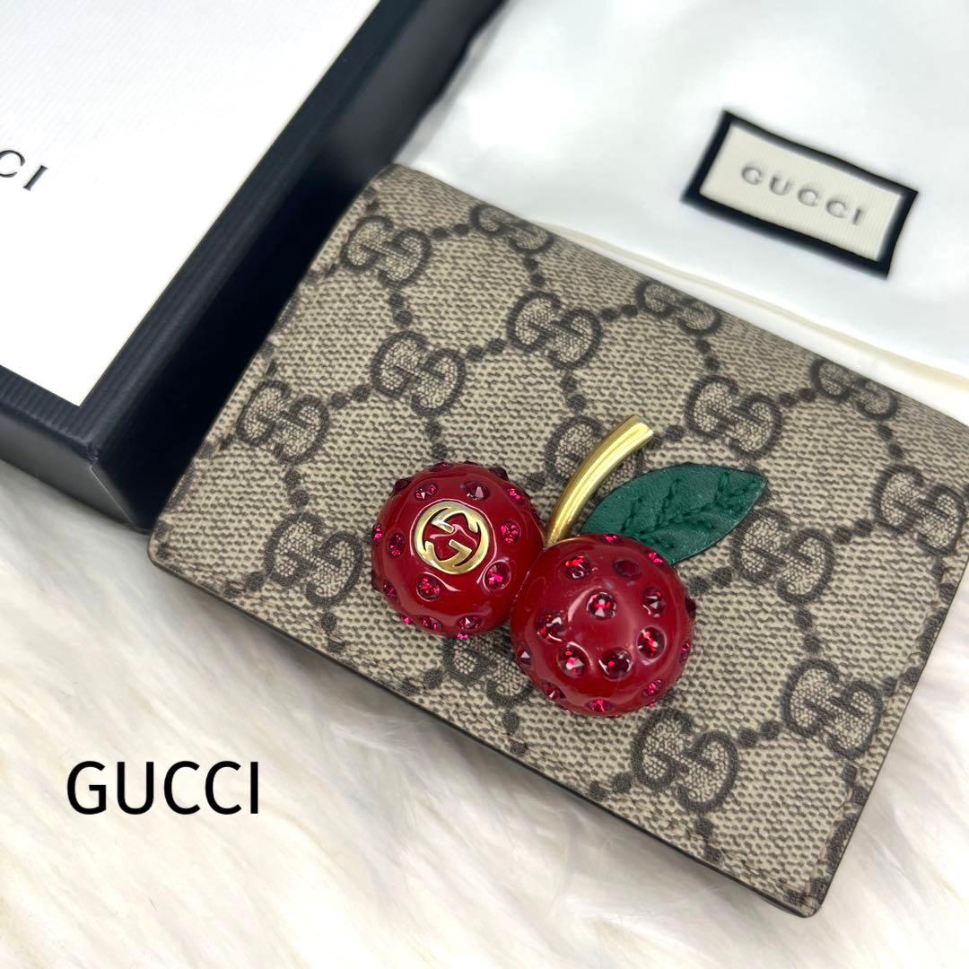 グッチ 二つ折り財布 ストーン欠けなし チェリー GGスプリーム 小売