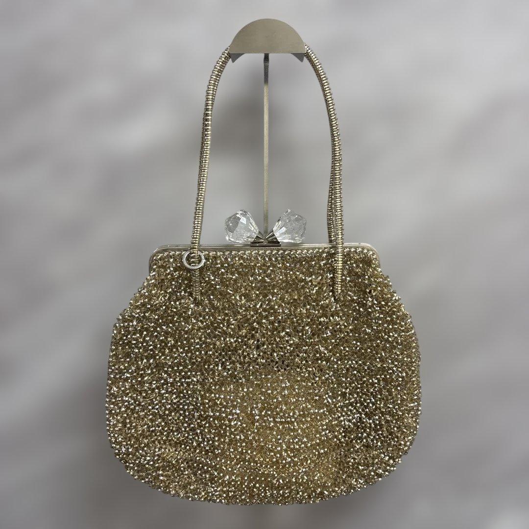 アンテプリマ　ワイヤーハンドバッグ　がま口　リボン　ゴールド