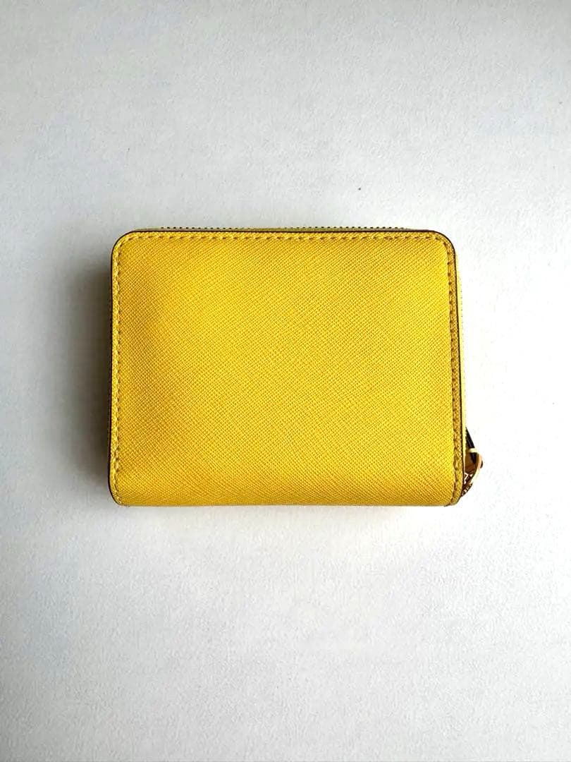 トリーバーチ イエロー 二つ折り財布 - メルカリ