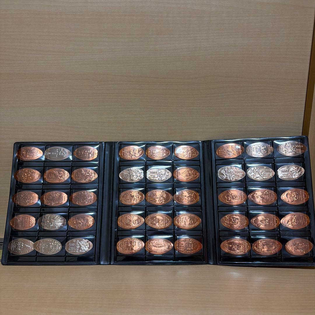 45枚】ディズニー スーベニアメダル まとめ売り 2007年 ブック付き