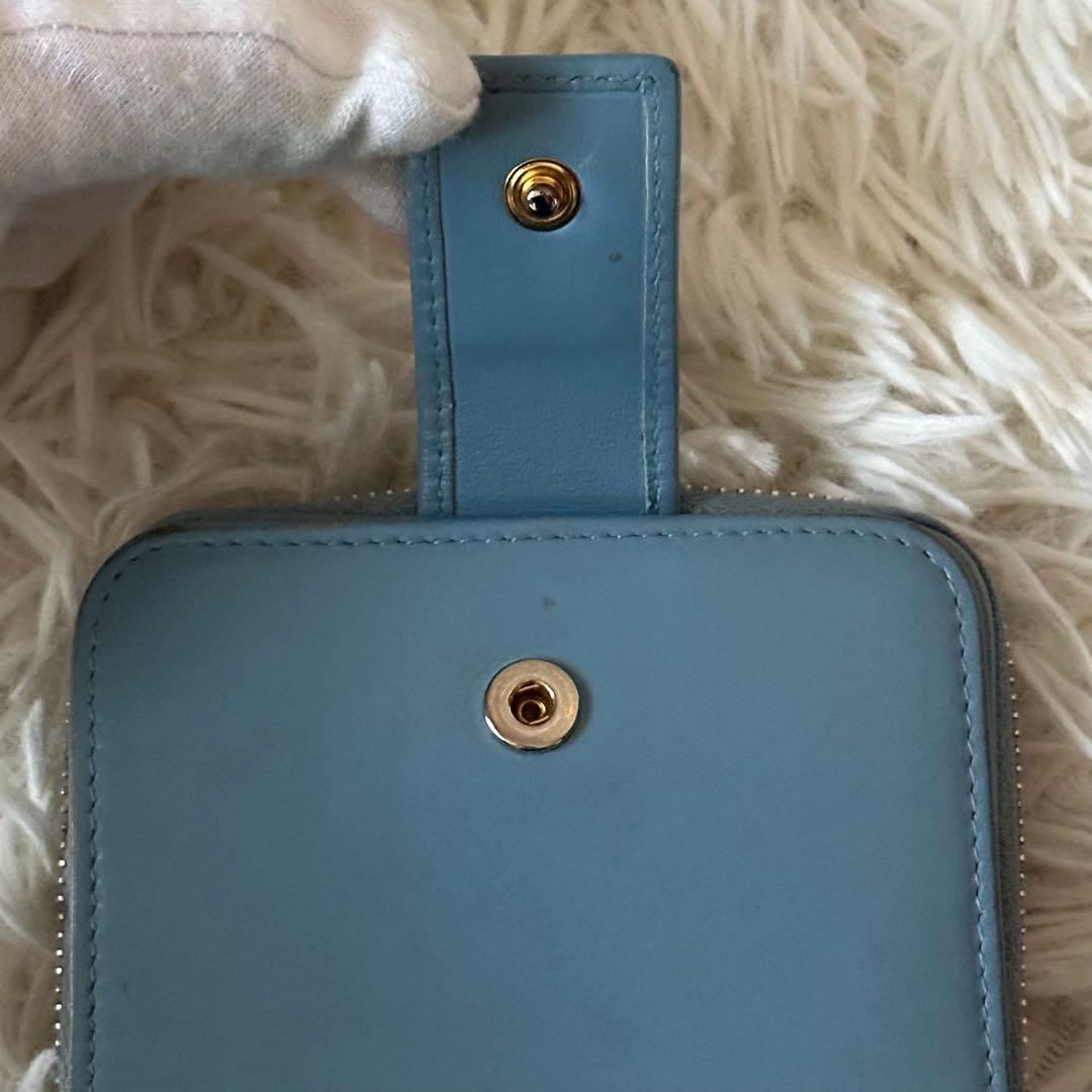 イヴサンローラン 二つ折り財布 型押し レザー ジップ ライトブルー コンパクト