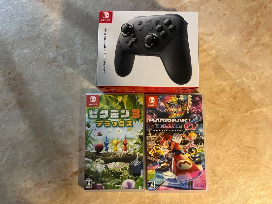 ゆ*ん様 Nintendo Switch 本体・カセット2つ・プロコンの3点セッ