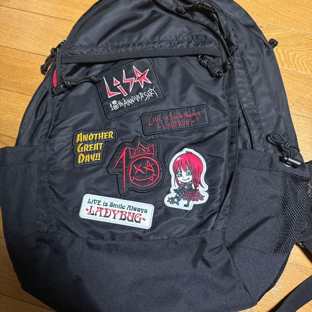 LiSA 10周年LIVEグッズ しょってんほしいのっ リュック - メルカリ