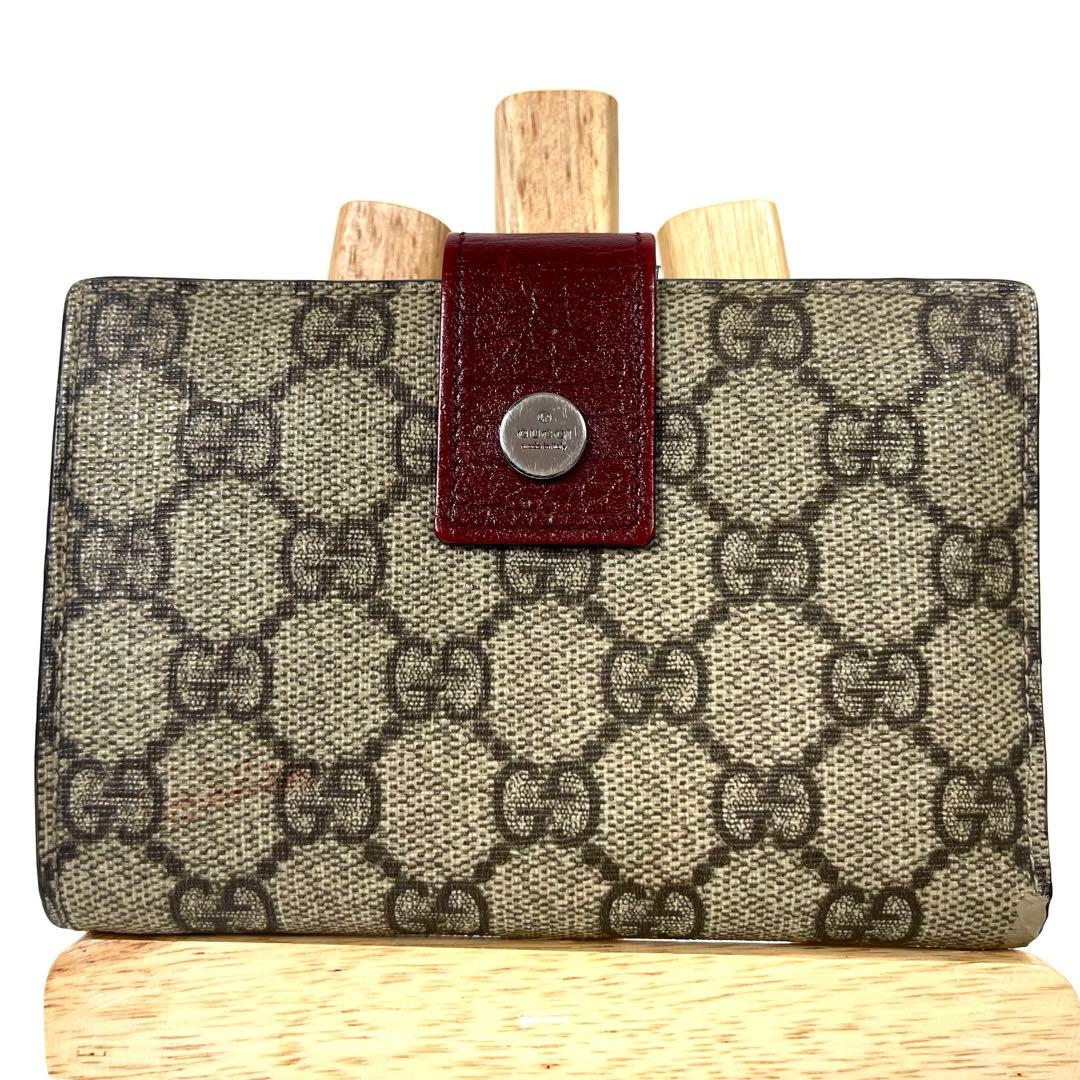 グッチ　折り財布　GGスプリーム　ロゴ総柄　がま口　ミディアム　PVC レザー