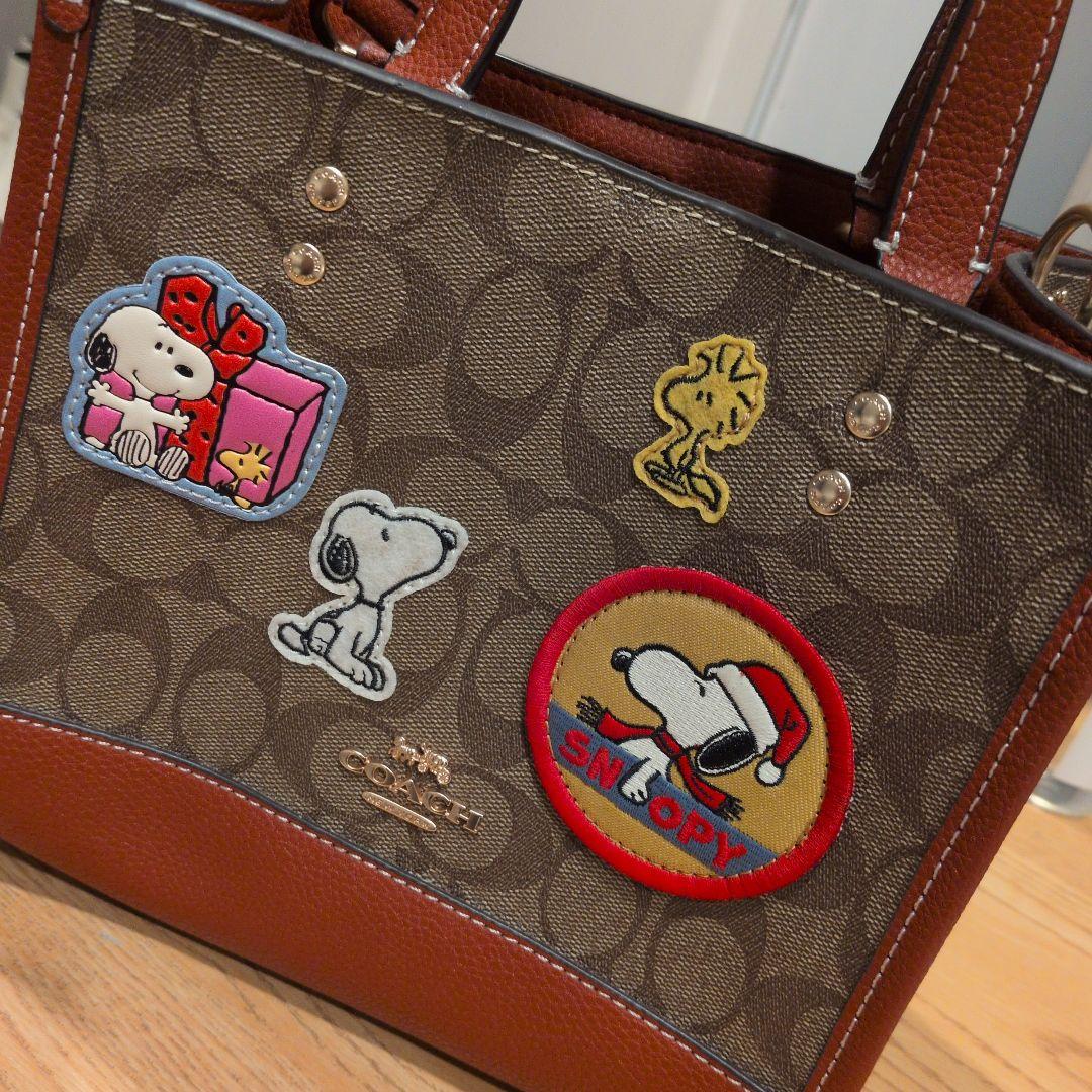 【美品】コーチスヌーピコラボデンプシートート22・シグネチャー キャンバスバッグ